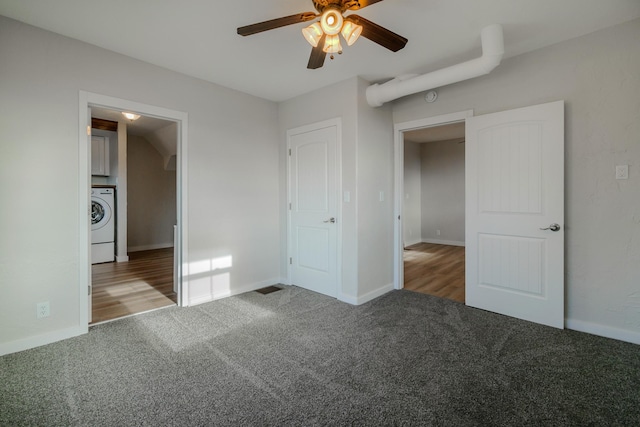 unfurnished bedroom with washer / clothes dryer, ceiling fan, and dark colored carpet