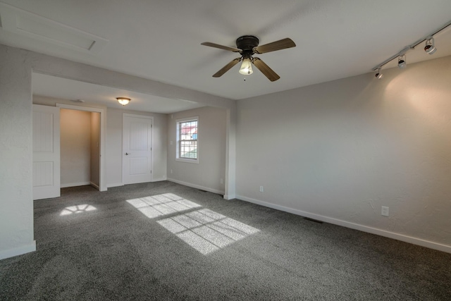 carpeted empty room featuring ceiling fan