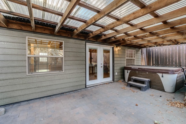 view of patio featuring french doors and a hot tub