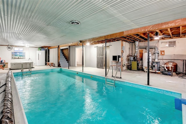 view of swimming pool with water heater