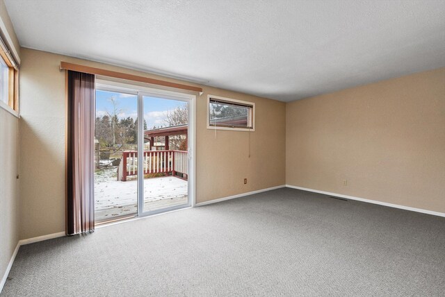 444 S Meridian Rd, Kalispell, MT 59901 - unfurnished bedroom with baseboards, carpet flooring, and multiple closets