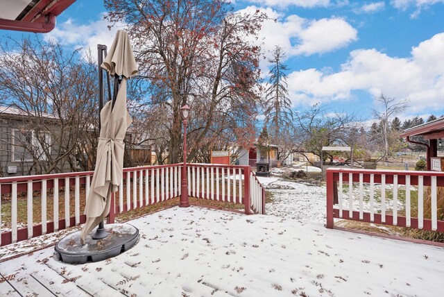 444 S Meridian Rd, Kalispell, MT 59901 - snow covered deck featuring a patio area