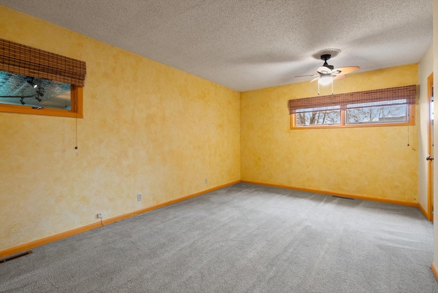 444 S Meridian Rd, Kalispell, MT 59901 - carpeted empty room featuring a ceiling fan, a textured ceiling, and baseboards
