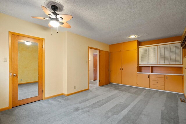 444 S Meridian Rd, Kalispell, MT 59901 - unfurnished bedroom with light colored carpet, a textured ceiling, and baseboards