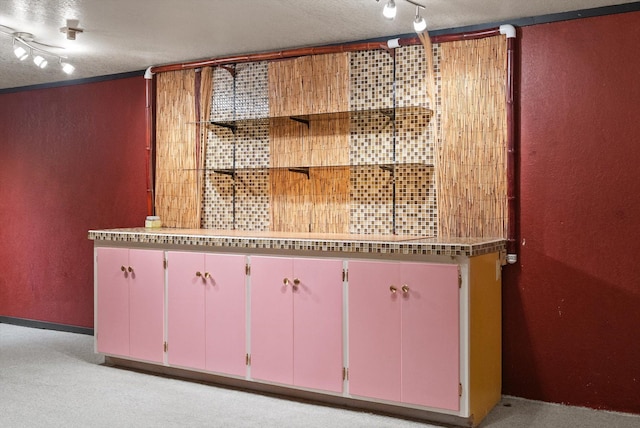 444 S Meridian Rd, Kalispell, MT 59901 - bar area featuring a textured wall and rail lighting