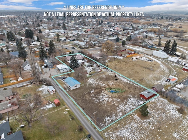 birds eye view of property with a residential view