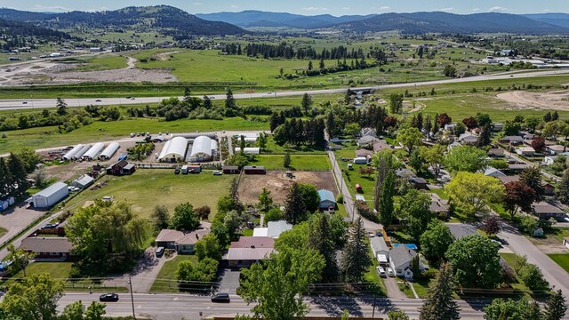 444 S Meridian Rd, Kalispell, MT 59901 - aerial view of property and surrounding area featuring a mountain backdrop
