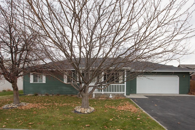 ranch-style house with a front yard and a garage