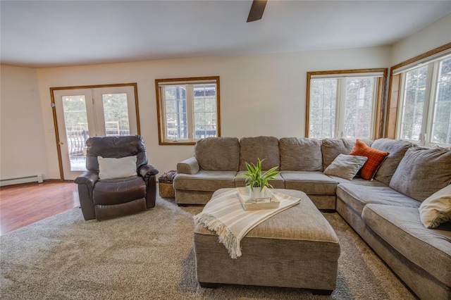 living room with ceiling fan, hardwood / wood-style floors, and a healthy amount of sunlight