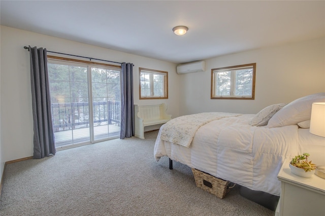 bedroom with access to exterior, carpet floors, and a wall mounted air conditioner