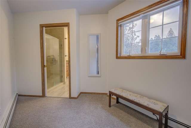 hall featuring carpet flooring and a baseboard radiator