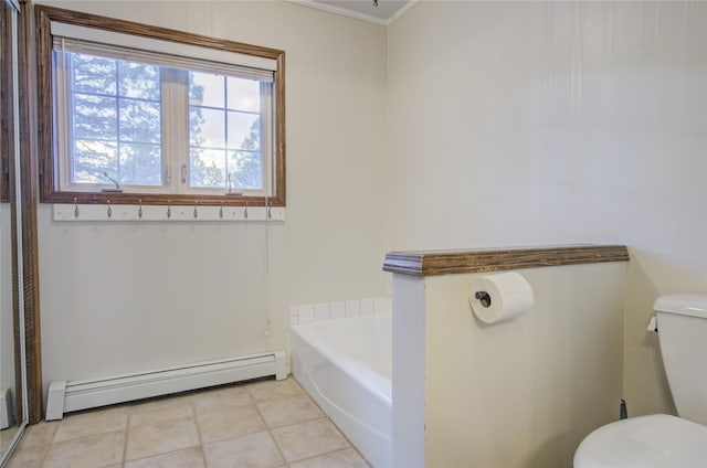 bathroom featuring a tub, baseboard heating, tile patterned flooring, toilet, and ornamental molding