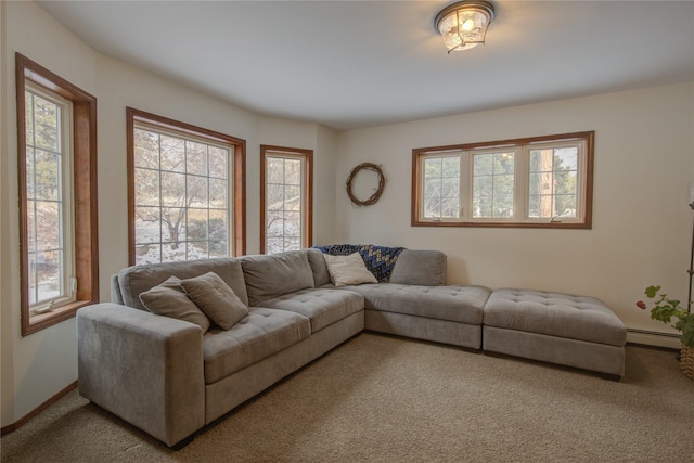 carpeted living room with a baseboard heating unit