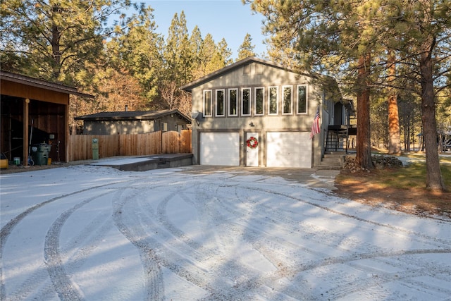 421 Tie Chute Ln, Florence, MT 59833 - view of front of house with a garage and concrete driveway