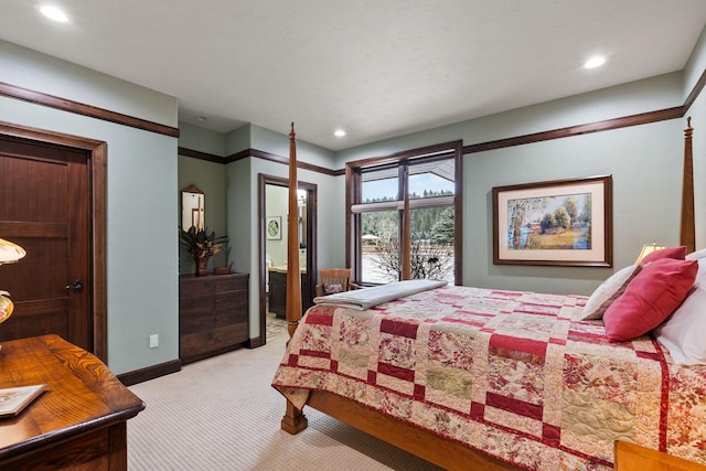 bedroom with light carpet and ensuite bathroom