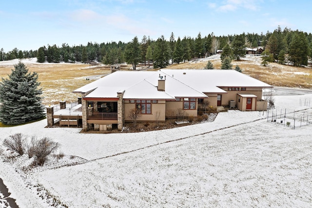 view of snow covered property