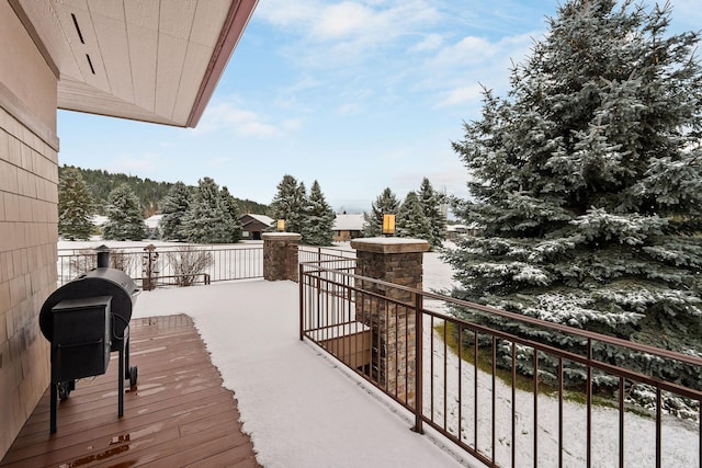 view of snow covered deck