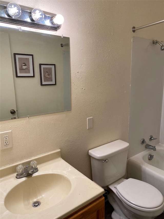 full bathroom with vanity, toilet, and bathtub / shower combination