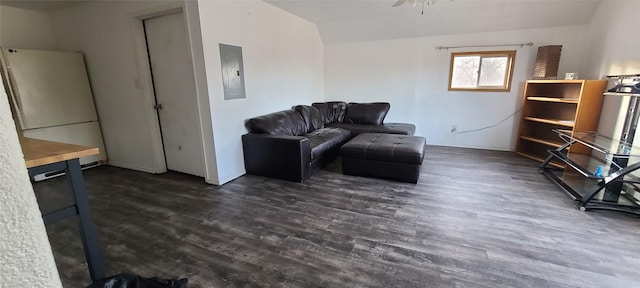 living room with electric panel, ceiling fan, and dark hardwood / wood-style flooring