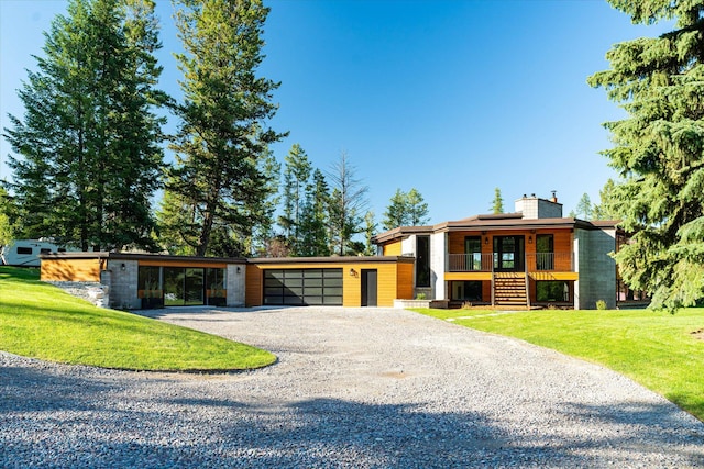 view of front facade featuring a garage and a front yard