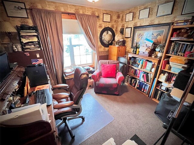 sitting room featuring baseboard heating, wood walls, light hardwood / wood-style flooring, and a drop ceiling