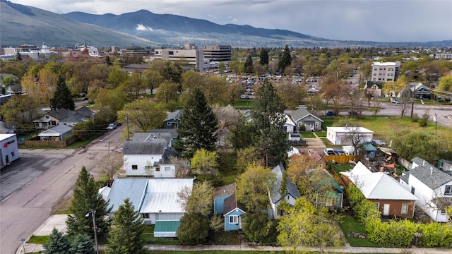 birds eye view of property featuring a mountain view