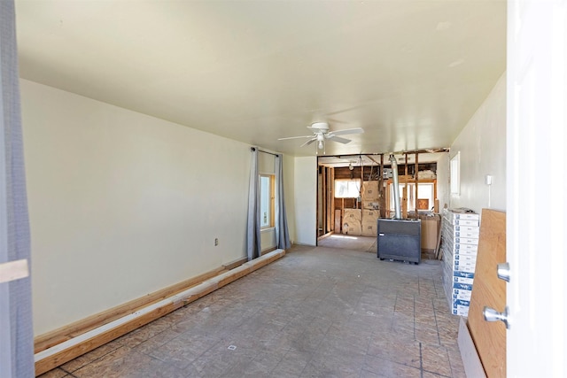 interior space featuring ceiling fan