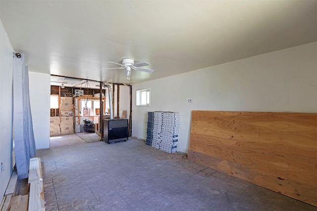 unfurnished living room featuring ceiling fan