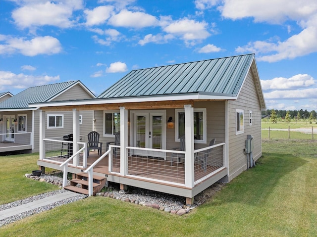 rear view of property with a yard and french doors