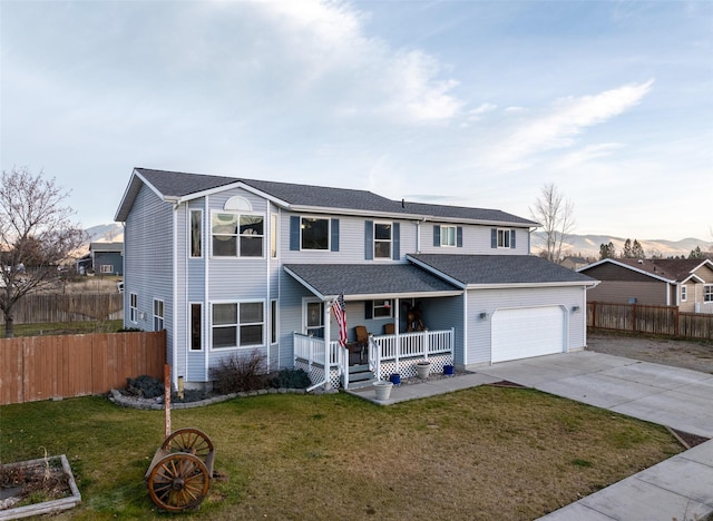 view of property featuring a front lawn and covered porch