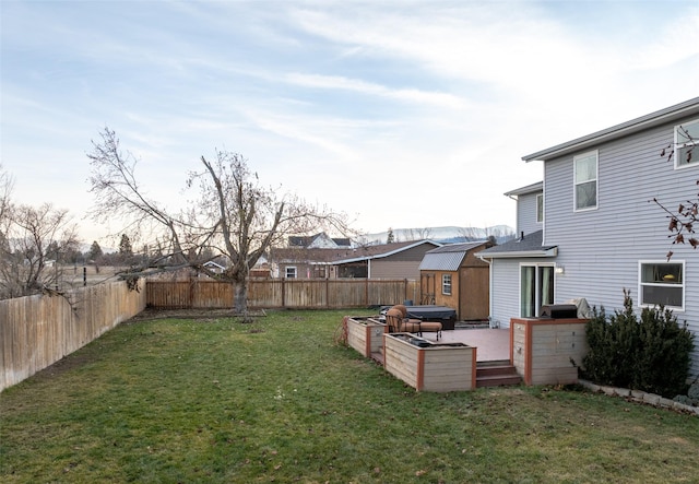 view of yard with a storage unit and a wooden deck