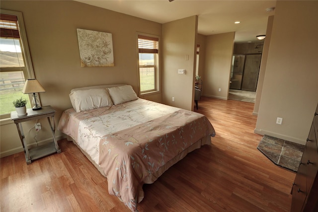 bedroom with light hardwood / wood-style flooring