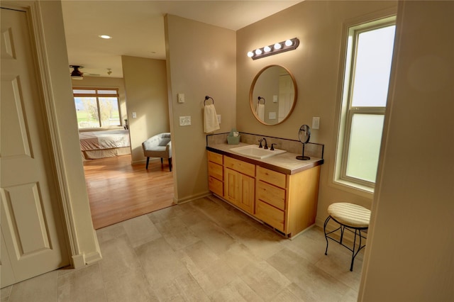 bathroom featuring ceiling fan and vanity