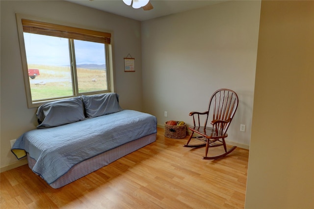 bedroom with hardwood / wood-style flooring and ceiling fan