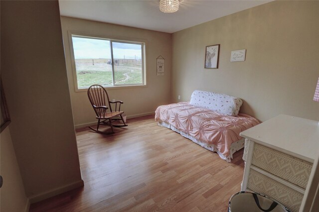 bedroom with hardwood / wood-style flooring