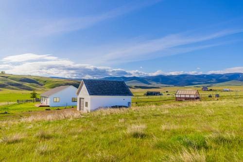 mountain view featuring a rural view