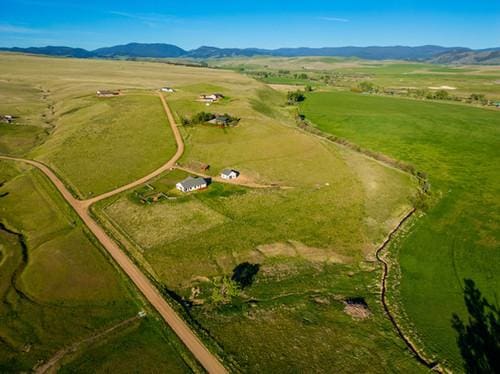 birds eye view of property featuring a rural view and a mountain view