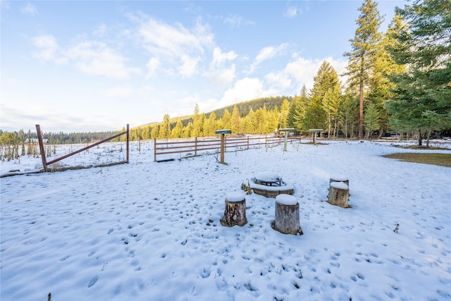 view of yard layered in snow