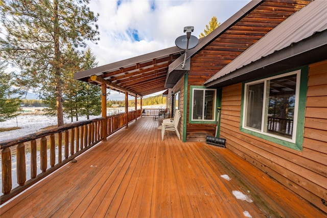 view of snow covered deck