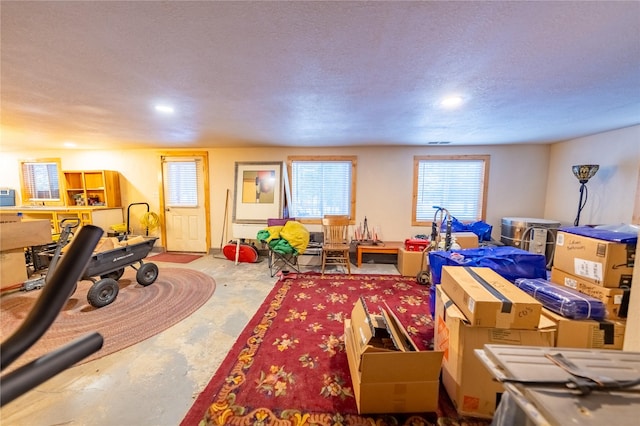 playroom featuring a textured ceiling