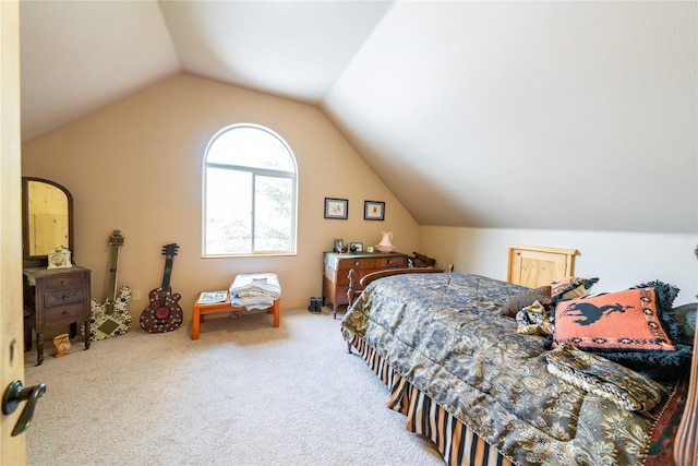 bedroom with carpet and lofted ceiling