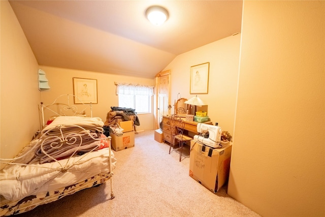 bedroom featuring carpet flooring and lofted ceiling