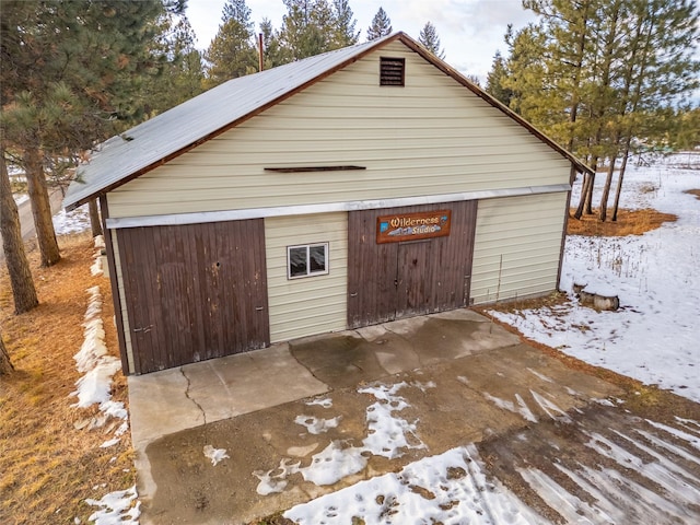 view of snow covered garage