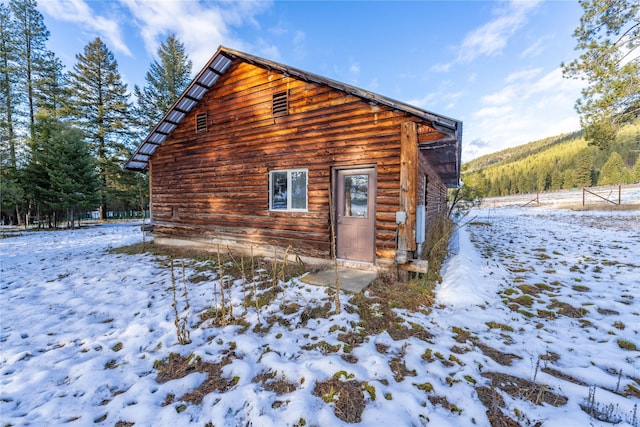 view of snow covered property