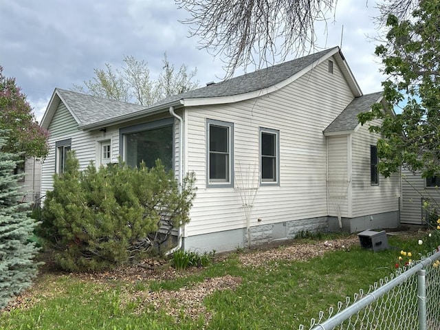 view of home's exterior featuring a lawn