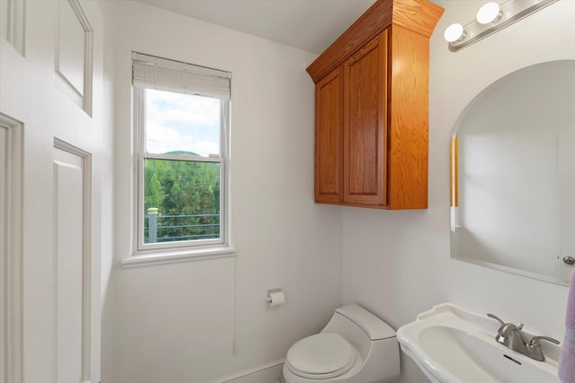 bathroom with sink and toilet