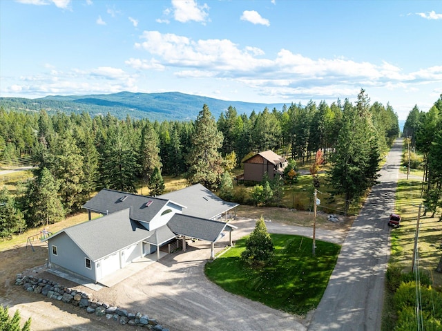 birds eye view of property with a mountain view