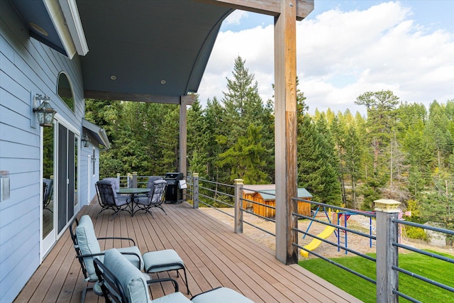 wooden deck featuring area for grilling