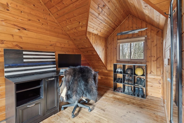 office space featuring light hardwood / wood-style floors, wood ceiling, lofted ceiling, and wood walls