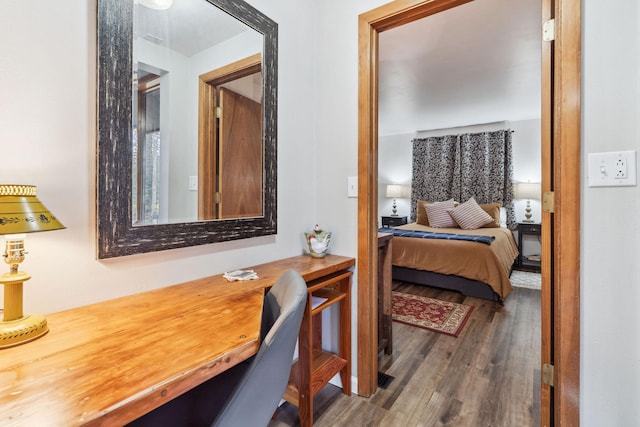 bedroom with hardwood / wood-style floors